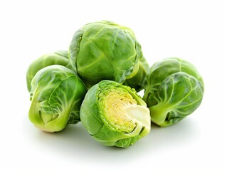 Fototapeta premium A pile of fresh Brussels sprouts isolated on a white background.