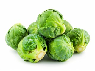 Fototapeta premium A pile of fresh Brussels sprouts isolated on a white background.