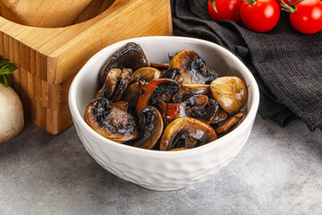 Roasted champignon mushrooms in the bowl