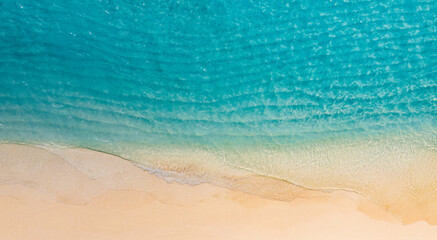 Relaxing aerial beach scene, summer vacation holiday template banner. Waves surf with amazing blue ocean lagoon, sea shore, coastline. Perfect aerial drone top view. Peaceful bright beach, seaside
