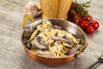Italian cuisine - farfalle with mushrooms