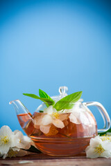 jasmine flower tea in a glass teapot