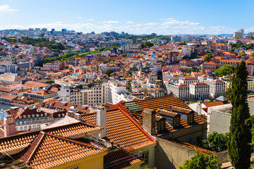 Aerial view of historical houses with red and coloured roofs, Lisbon, Portugal. Urban Cityscape Neighborhood. Alfama Portugal, beautiful European city