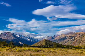 Fototapeta premium Patagonia mountains in El Chalten, Argentina. Monte Fitzroy and Cerro Torre summits granite walls above lake laguna Torre with icebergs floating ice and dark clouds nasty patagonian weather 