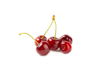 Cherry isolated. Fresh ripe cherries with leaves isolated on a white background.Sweet cherries pile. Berries and fruits. Vegan. Healthy eating.
