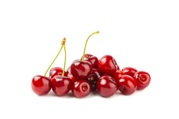 Cherry isolated. Fresh ripe cherries with leaves isolated on a white background.Sweet cherries pile. Berries and fruits. Vegan. Healthy eating.