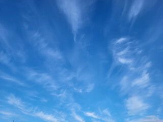Fototapeta premium Beautiful blue sky and feathery white clouds nice bright day