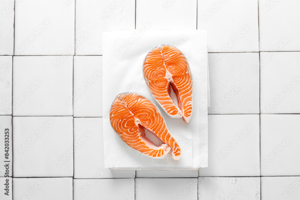 Wall mural fresh salmon steaks with herbs and ingredients for cooking, top view - Wall murals