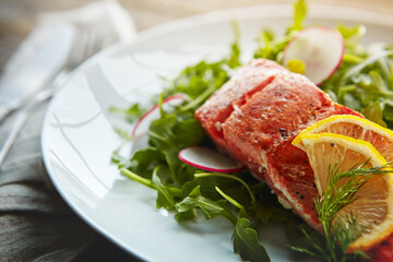Food plate, fish protein and salad for health with nutrition, lunch and wellness with pescatarian diet. Salmon, rocket leaves and dinner on table with cholesterol for vitamin c benefits and digestion