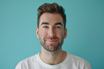 Fototapeta premium A close up portrait of a young man with a subtle smile