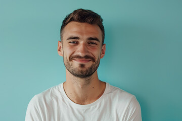 Obraz premium A close up portrait of a young man with a subtle smile