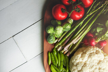 Home, desk and vegetable on cutting board for cooking with diet, nutrition and healthy living. Fresh, food and kitchen counter with organic or vegetarian meal for wellness, wellbeing and self care
