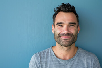 Obraz premium A close up portrait of a young man with a subtle smile