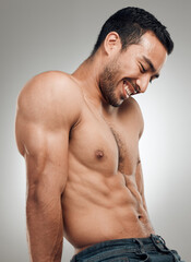 Man, thinking and confident in studio with abs or muscles, shirtless and grey background with model...