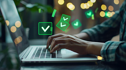A person typing on their laptop with green checkmark icons floating above the keyboard. attention to detail and quality control in work 