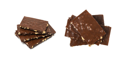 Broken nut chocolate bar stack, isolated. Milk chocolate square pieces, cubes, small bloks pile,...