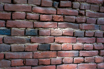 Timeless Beauty. Old Brick Wall Structure in Light and Shadow on a Sunny Day.