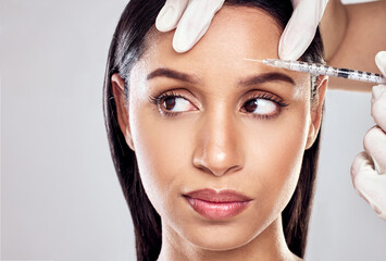 Hand, needle and woman in studio for plastic surgery with beauty transformation and cosmetic...
