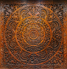 Intricate Indonesian Balinese carved wooden art texture background featuring detailed floral and...