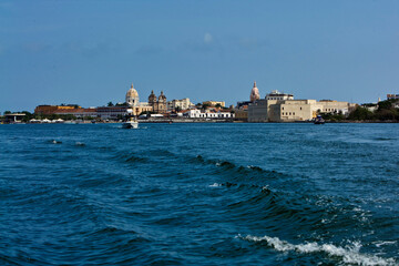 Cartagena, Bolivar, Colombia. February, 2020: City convention center and boat on the sea.