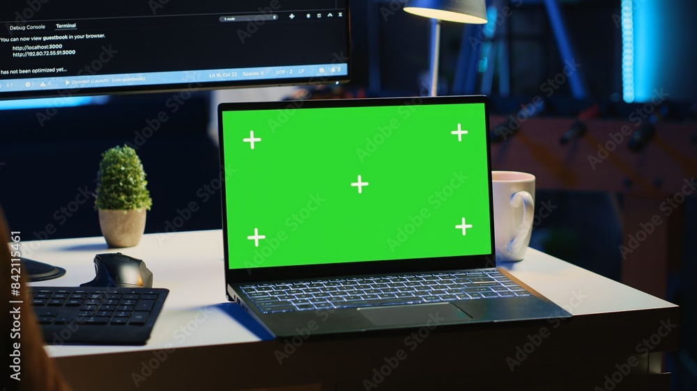 Poster green screen laptop in home office used for developing software applications. mockup notebook used b