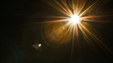 Obraz premium Bright lens flare effect with rays of light and bokeh on dark background for creative design and visual effects