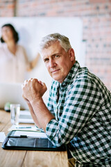 Obraz premium Portrait, creative and mature man at presentation, project management and planning in workshop. Confidence, meeting room and designer at startup for growth, development or opportunity in office.