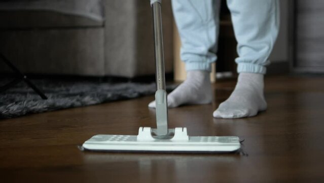 House cleaning. Cleaning of apartments, mopping parquet floors, Hygiene and cleanliness in apartments