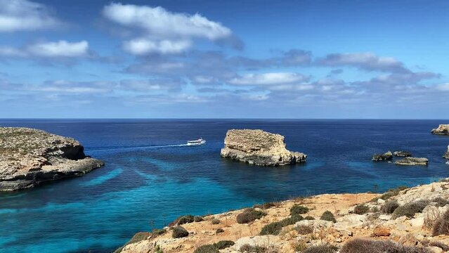 Comino Island Malta, Boat rides and visits to Comino Caves. Blue mediterranean sea. High quality 4k footage