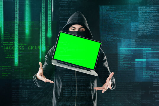 Man, laptop and portrait on black background for hacking, phishing and malware with green screen. Hacker, software and floating tech for cyber crime, hacktivism or cryptocurrency thief with mockup - Powered by Adobe