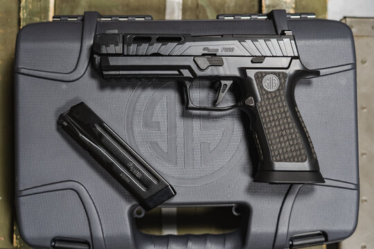 Baltic States July 6, 2024. A modern new pistol for sport and tactical shooting, sig sauer p320 spectre comp 9mm, made in the USA.