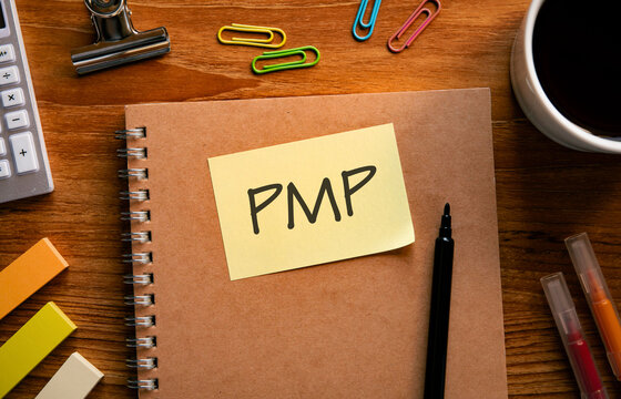 There is sticky note with the word PMP. It is an abbreviation for Project Management Professional as eye-catching image.