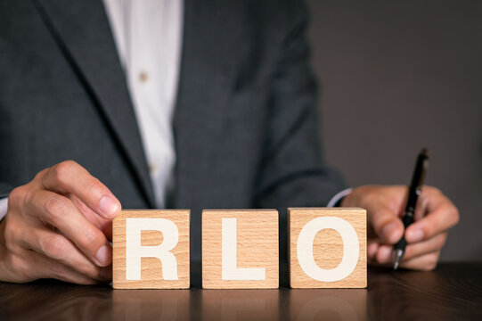 There is wood cube with the word RLO. It is an abbreviation for Recovery Level Objective as eye-catching image.