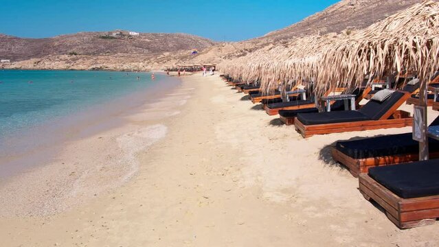 Mykonos, Greece, Elia Beach. Pristine bay with blue sea and crystal water, famous for naturism, LGBT plus friendly, peaceful and quiet. Gimbal cinematic Log footage