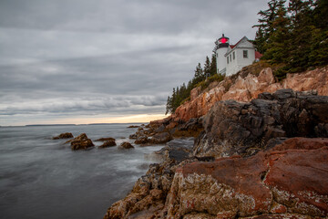 Arcadia's lighthouse in bar harbor in sunset