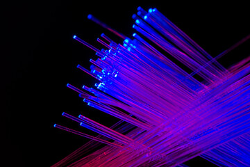 abstract background with lights in optical fibers on a black background