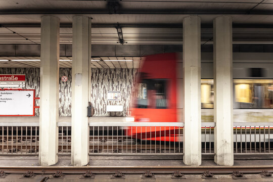 COLOGNE, GERMANY - NOVEMBER 6, 2022: Selective blur on a tram entering a tram station in Cologne Koln, part of Cologne Stadtbahn, urban railway train system in an underground station.