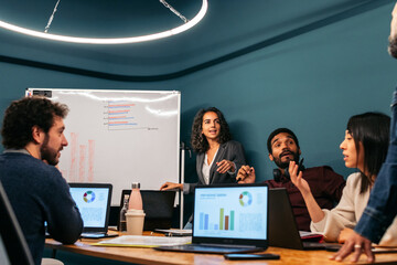Group of multiracial people working with laptop in a coworking