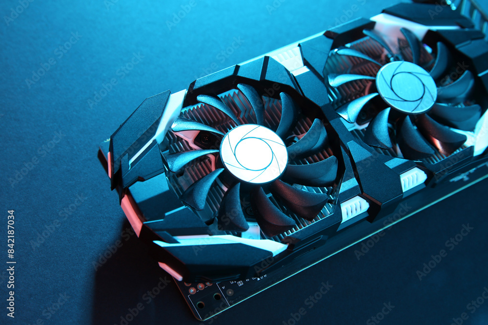 Poster computer graphics card on color background, closeup
