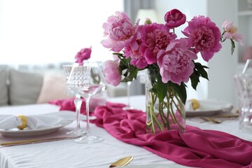 Beautiful table setting with pink peonies in dining room