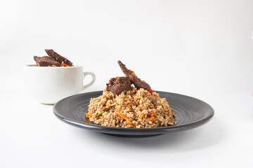 nasi kebuli, indonesian food with brown rice spicy and goat meat isolated
