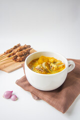 bowl of Gulai curry, indonesian traditional food isolated background