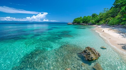 A serene tropical beach with crystal clear turquoise waters against a backdrop of lush greenery and a bright blue sky on a sunny day