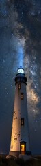 A beautiful lighthouse at night with the milky way visible in the night sky. 