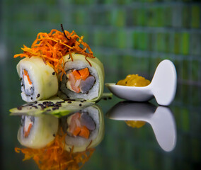 Cucumber maki sushi pieces and mango chutney sauce