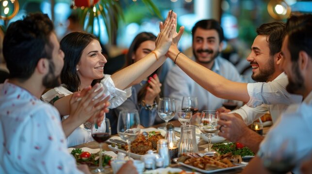 Group of diverse friends having fun at a restaurant. AIG535