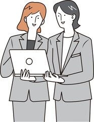 パソコンを持って話し合う女性社員