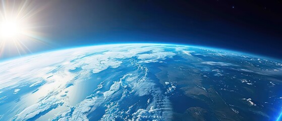 Obraz premium Earth from space, blue sky with sun in upper left corner, atmospheric perspective, dark background