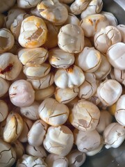 A large pile of peeled and ready-to-eat Toddy Palm fruits.