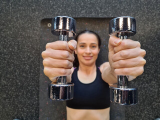 Woman Lifting Dumbbells During Workout at Gym